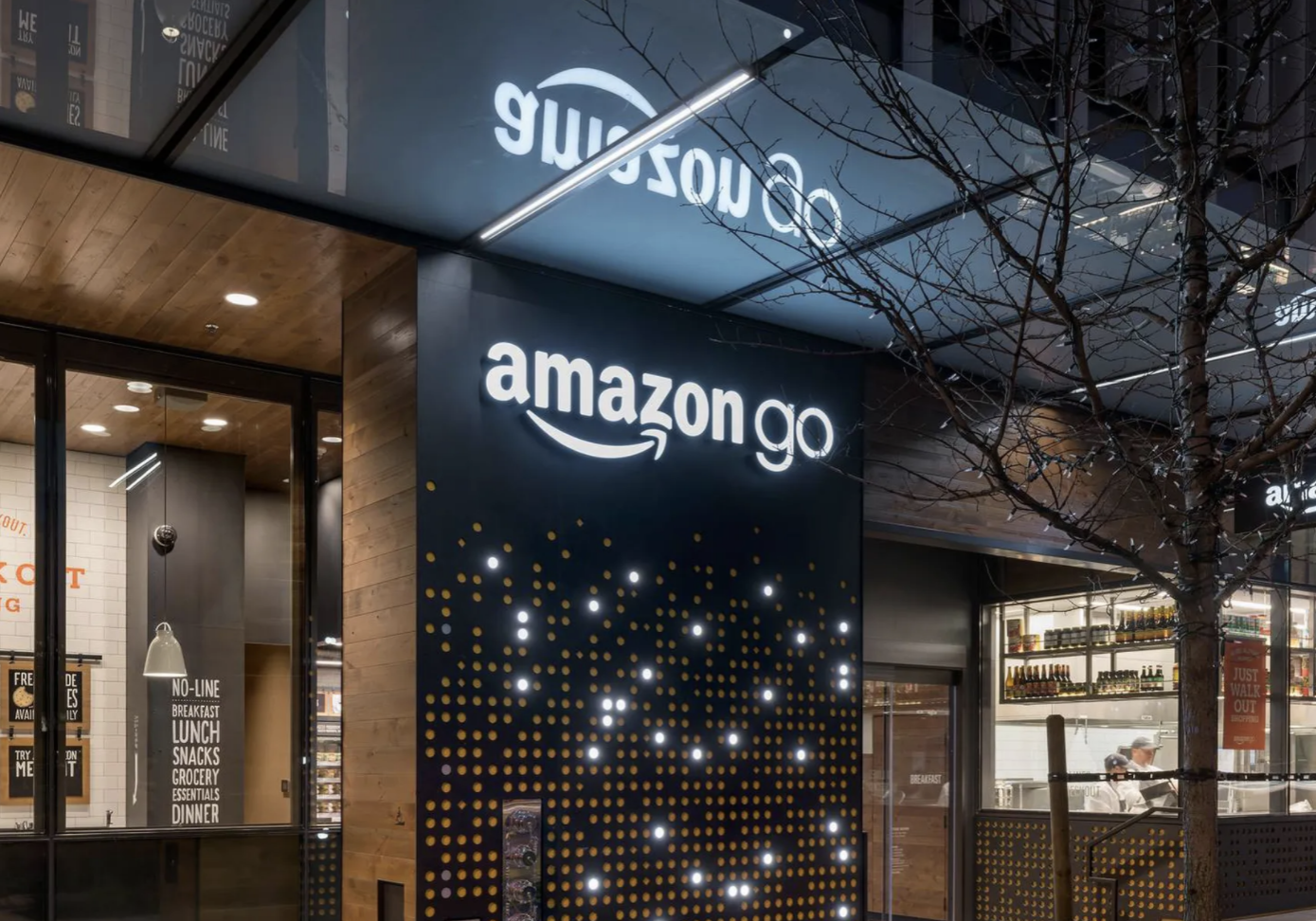 A storefront of an Amazon go store showing the logo